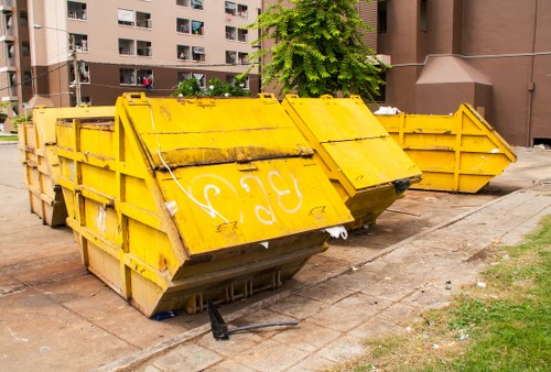 Construction site with waste management practices in Ealing