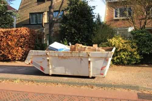 Satisfied homeowner after garage and loft clearance in Ealing